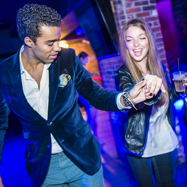One of the best DJ's in Boston dances with guest at corporate event